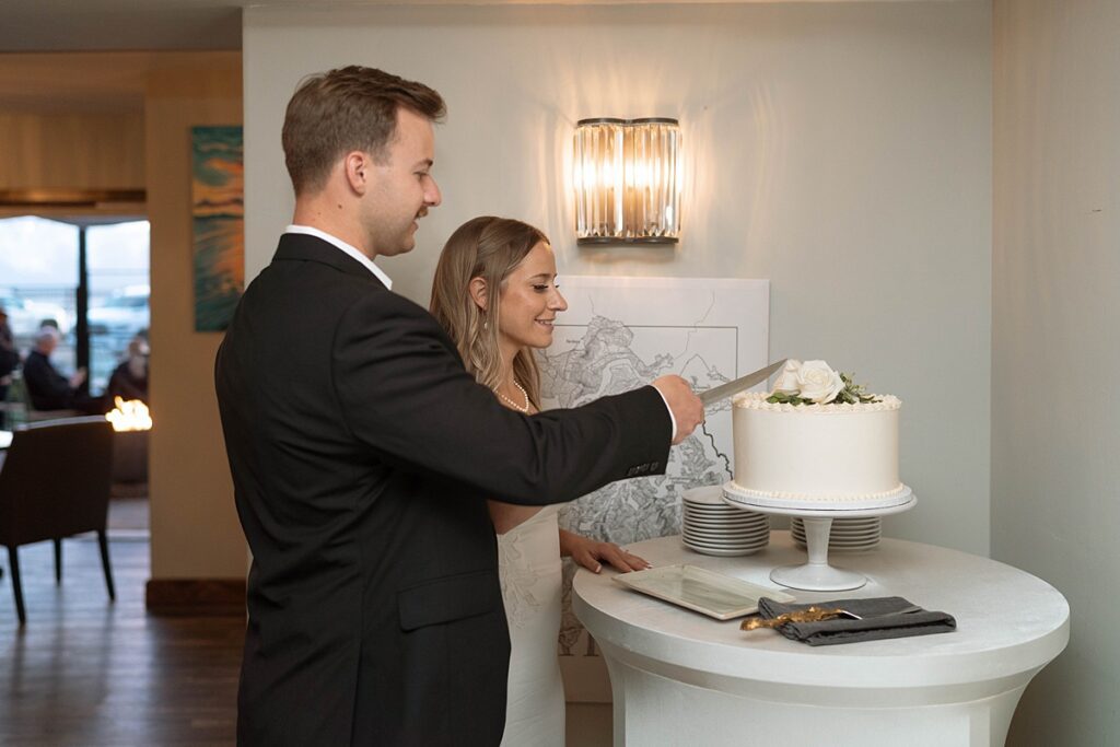 bride and groom cutting the cake. lake tahoe elopement. Reception dinner at Jimmy's in the Landing. lake tahoe wedding elopement photographer videographer. 4JOY media