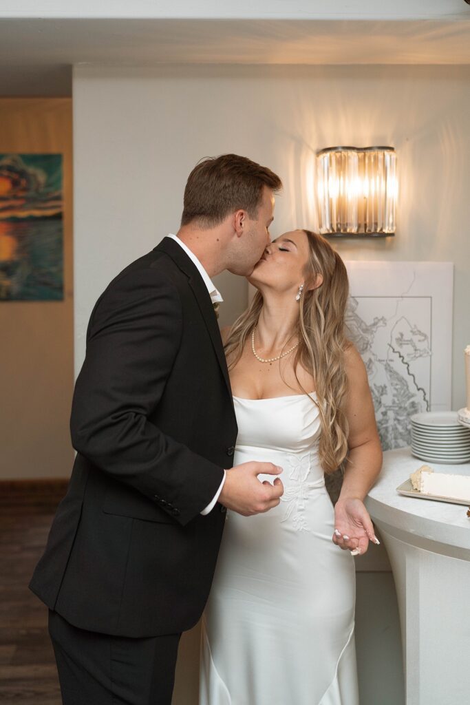 bride and groom cutting the cake. lake tahoe elopement. Reception dinner at Jimmy's in the Landing. lake tahoe wedding elopement photographer videographer. 4JOY media