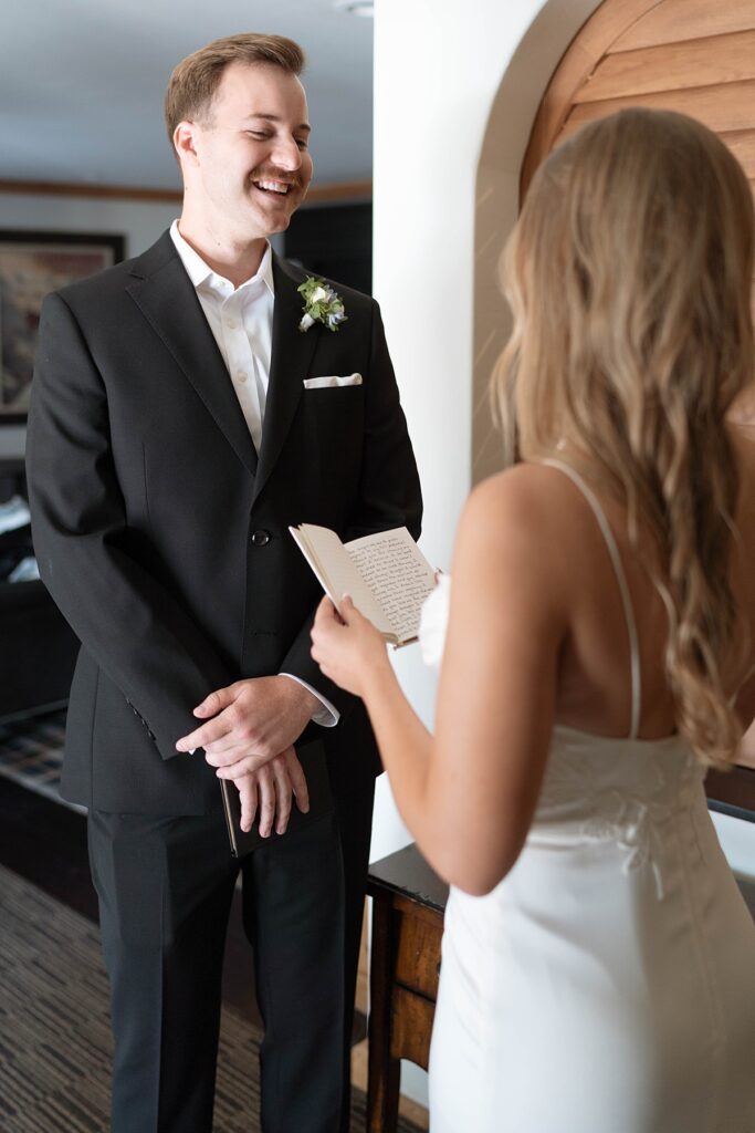 bride and groom reading private vows in their hotel room. lake tahoe wedding elopement photographer videographer. 4JOY media