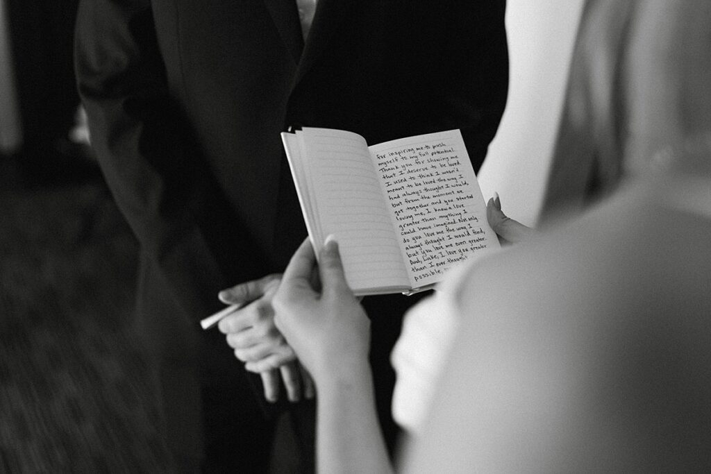 bride and groom reading private vows in their hotel room. lake tahoe wedding elopement photographer videographer. 4JOY media
