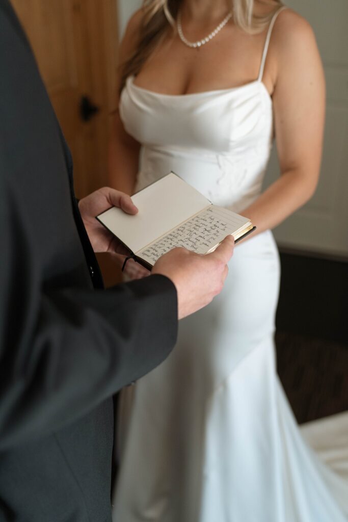 bride and groom reading private vows in their hotel room. lake tahoe wedding elopement photographer videographer. 4JOY media