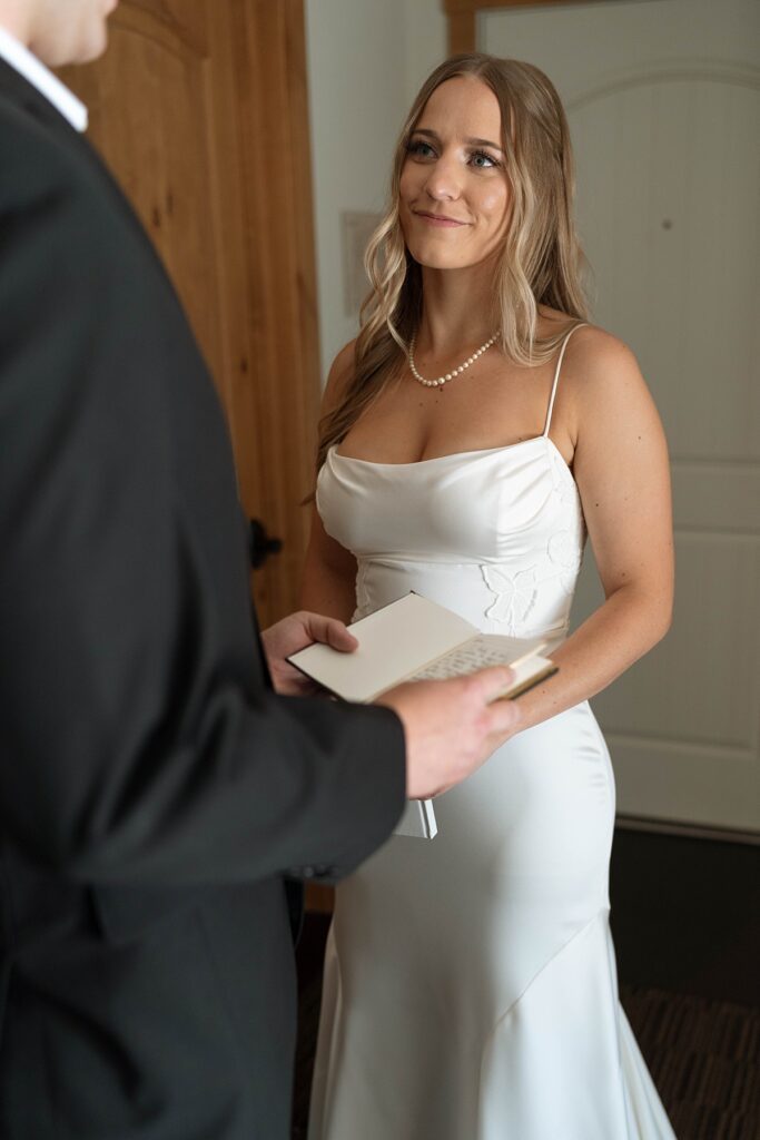 bride and groom reading private vows in their hotel room. lake tahoe wedding elopement photographer videographer. 4JOY media
