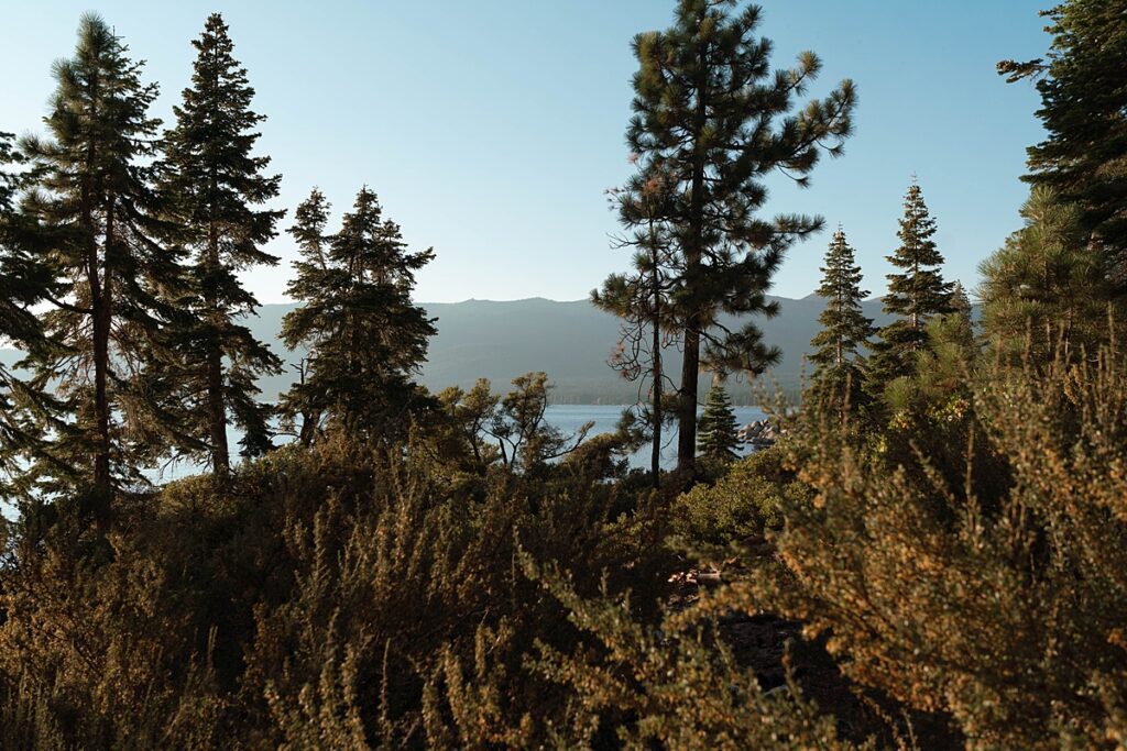 lake tahoe nevada engagement photos climbing on the rocks near sand harbor. lake tahoe engagement photographer