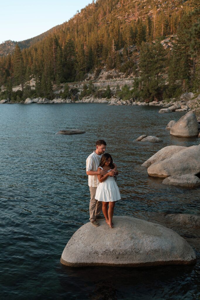 lake tahoe nevada engagement photos climbing on the rocks near sand harbor. lake tahoe engagement photographer