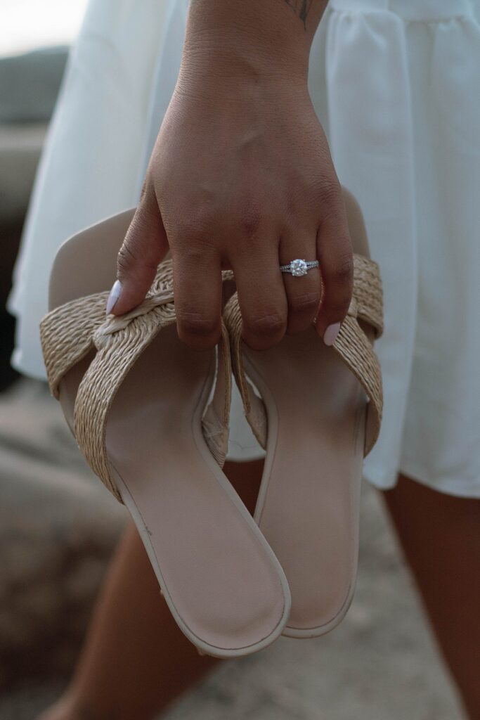 lake tahoe nevada engagement photos climbing on the rocks near sand harbor. lake tahoe engagement photographer
