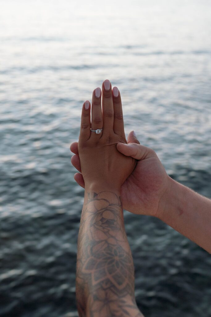 lake tahoe nevada engagement photos climbing on the rocks near sand harbor. lake tahoe engagement photographer