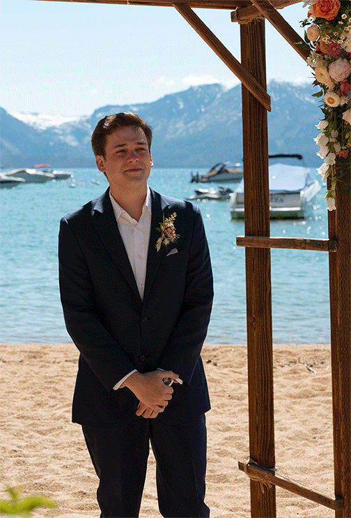 grooms reaction to the bride walking down the aisle. bride and groom ceremony at round hill lake tahoe resort. Roundhill Beach Lake Tahoe Elopement Photographer Videographer 4JOY Media