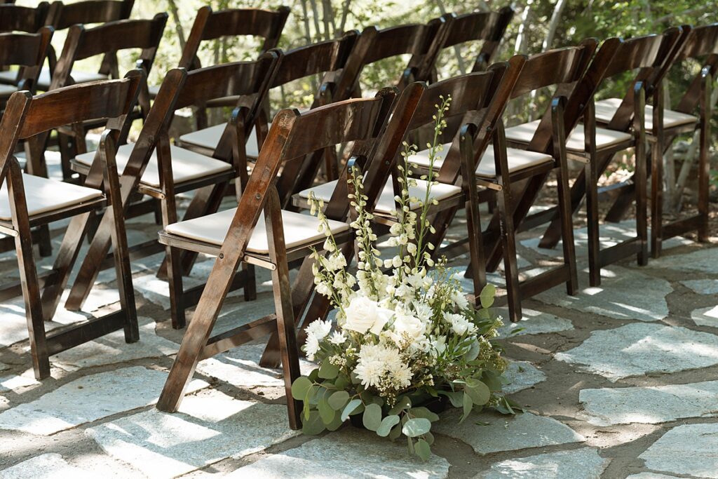 wedding ceremony chairs and florals. Plumpjack inn Truckee Palisades Lake Tahoe Wedding photographer videographer