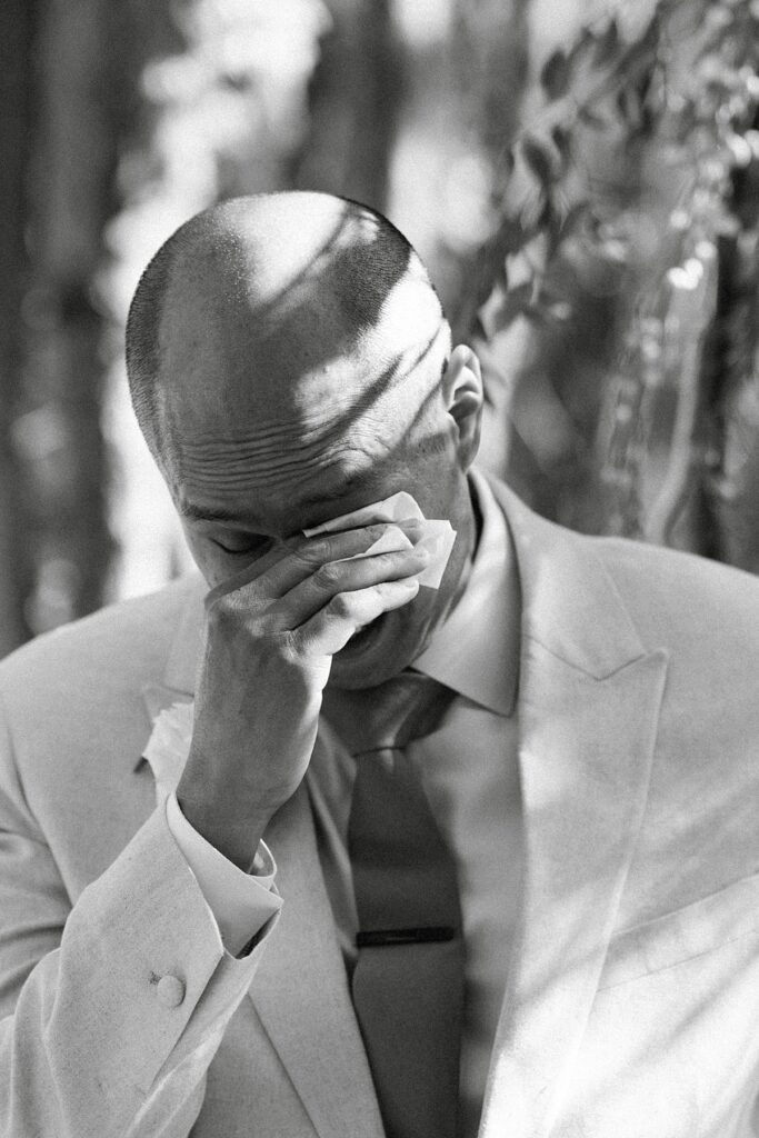 groom crying as the bride walks down the aisle. Plumpjack inn Truckee Palisades Lake Tahoe Wedding photographer videographer