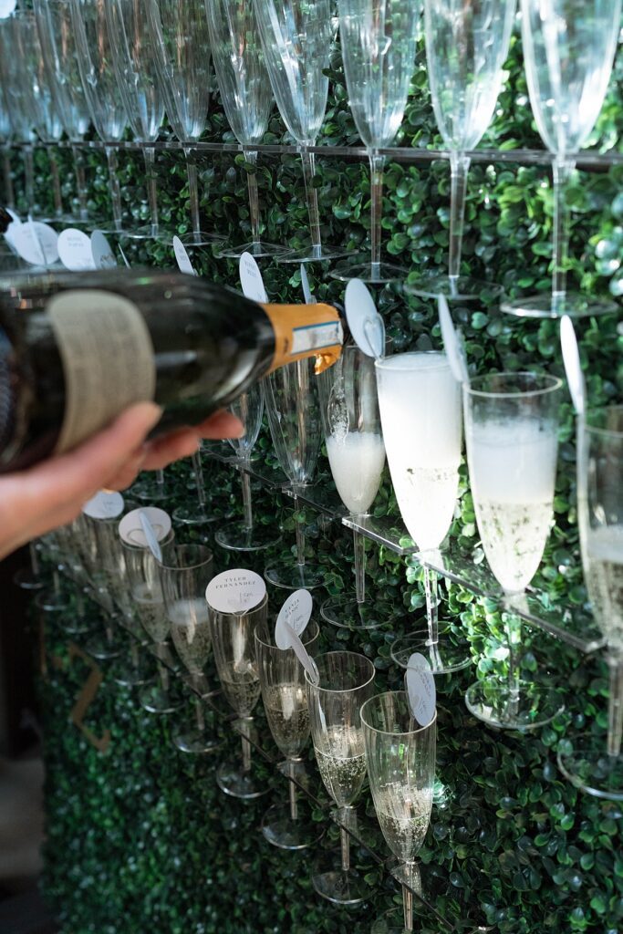 champagne wall. Plumpjack inn Truckee Palisades Lake Tahoe Wedding photographer videographer