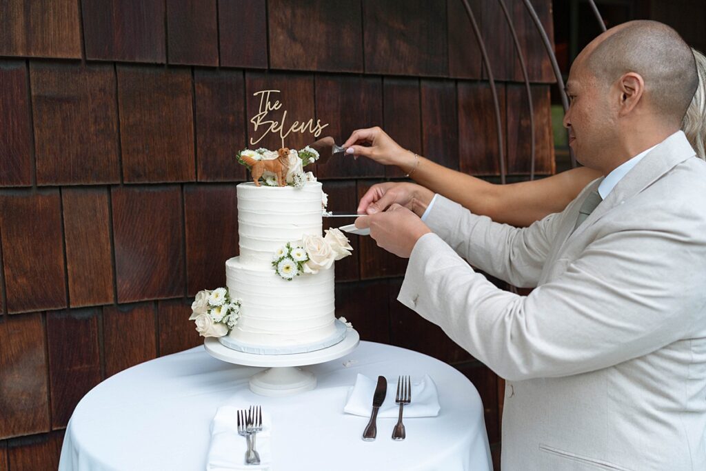 cutting the wedding cake. Plumpjack inn Truckee Palisades Lake Tahoe Wedding photographer videographer
