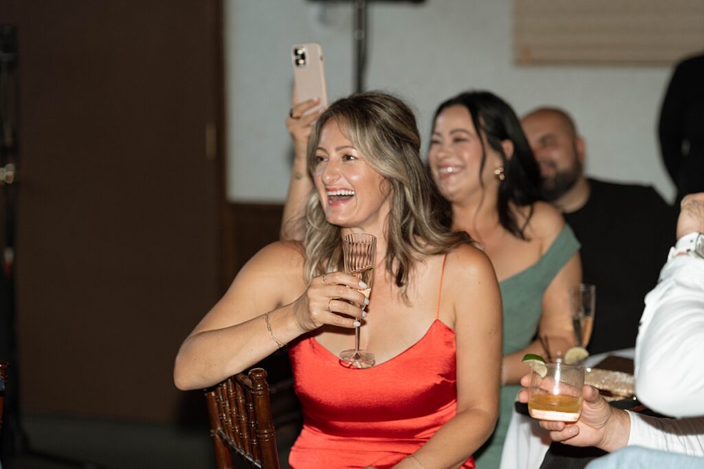 guest reaction to speeches at the wedding reception.  Plumpjack inn Truckee Palisades Lake Tahoe Wedding photographer videographer