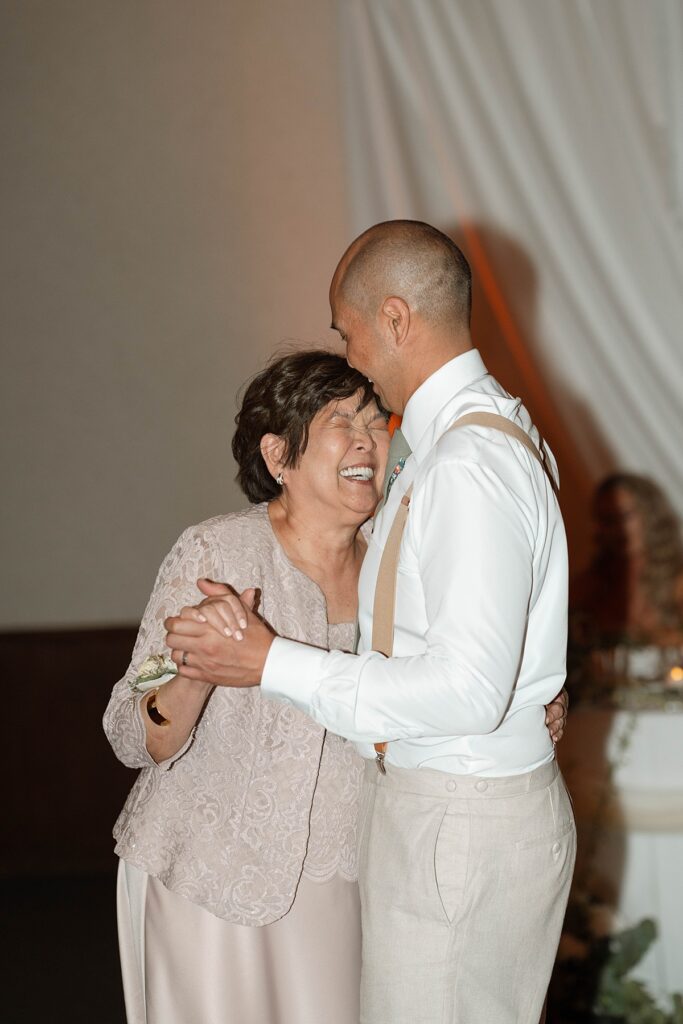 mother son dance at the wedding reception.  Plumpjack inn Truckee Palisades Lake Tahoe Wedding photographer videographer