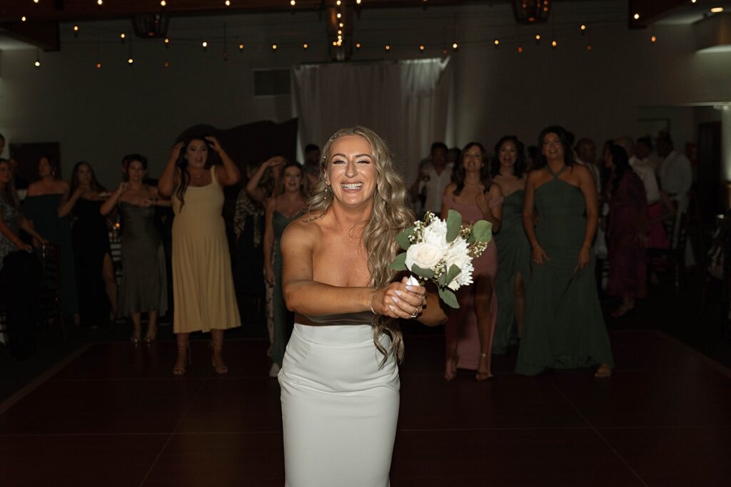 bouquet toss. Plumpjack inn Truckee Palisades Lake Tahoe Wedding photographer videographer