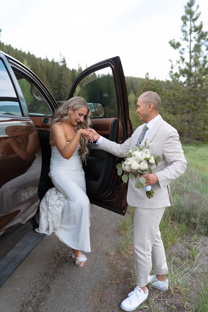 bride and groom getting out of their truck to take portraits. Plumpjack inn Truckee Palisades Lake Tahoe Wedding photographer videographer