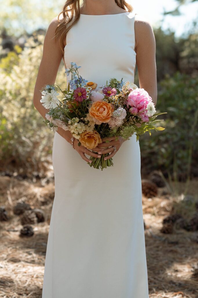 bride and bridal bouquet. Roundhill Beach Lake Tahoe Elopement Photographer Videographer 4JOY Media