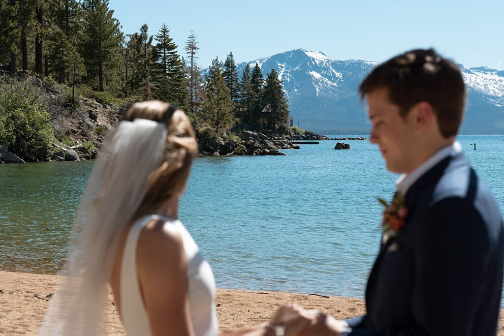 bride and groom at their wedding ceremony. Roundhill Beach Lake Tahoe Elopement Photographer Videographer 4JOY Media