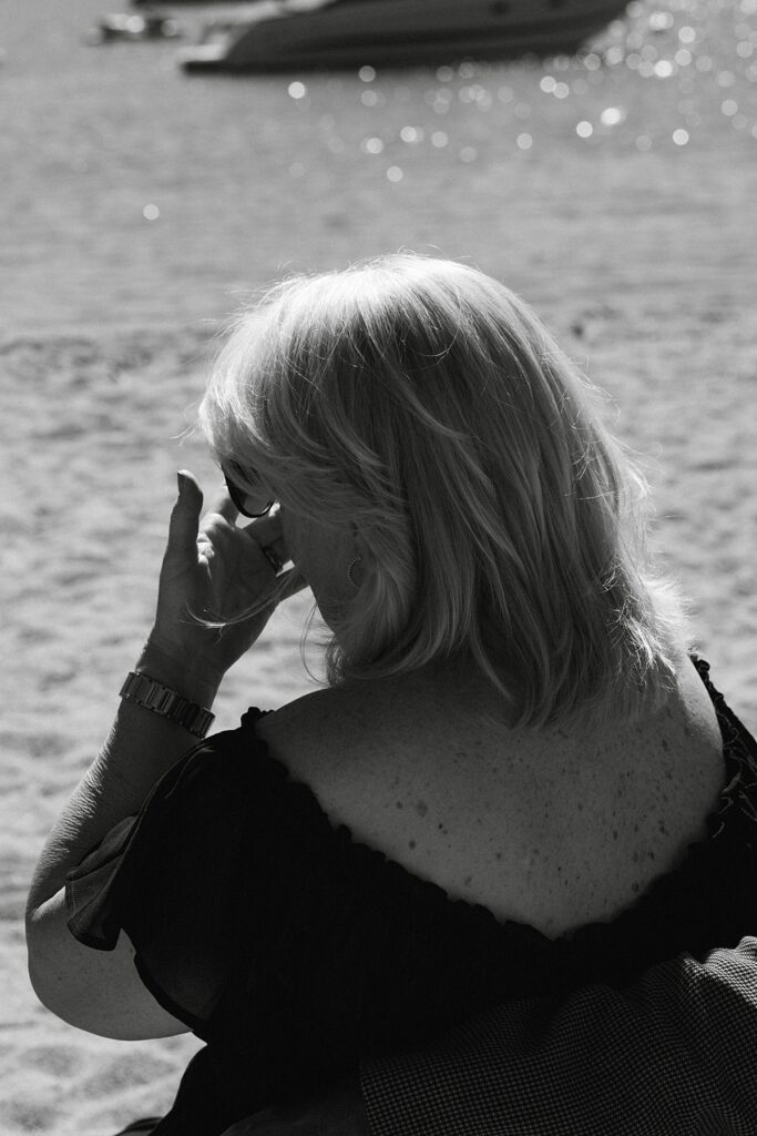 mom of the groom crying at the ceremony. Roundhill Beach Lake Tahoe Elopement Photographer Videographer 4JOY Media