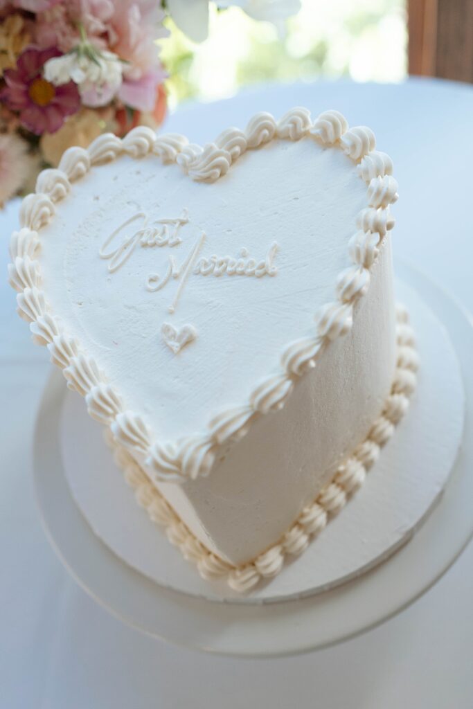 wedding cake. classic white wedding cake. heart shaped wedding cake. Edgewood Resort Reception Lake Tahoe Elopement Photographer Videographer