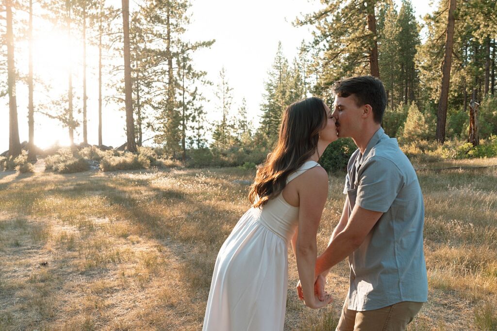couple passionately kisses in lake tahoe zephyr cove meadow