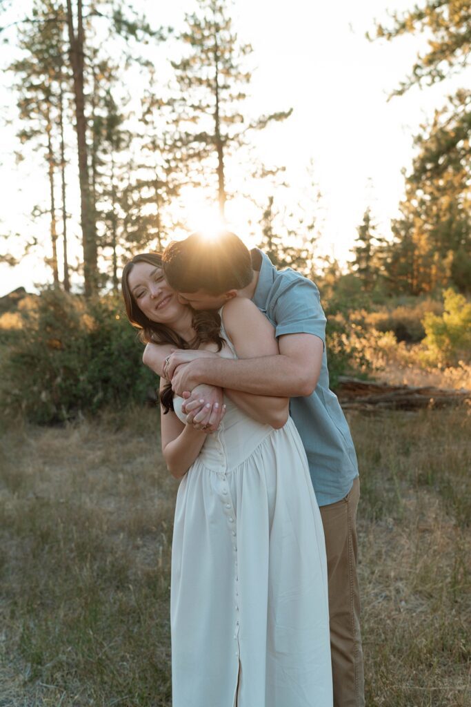 candid sweet embrace between an engaged couple during their lake tahoe adventure engagement session