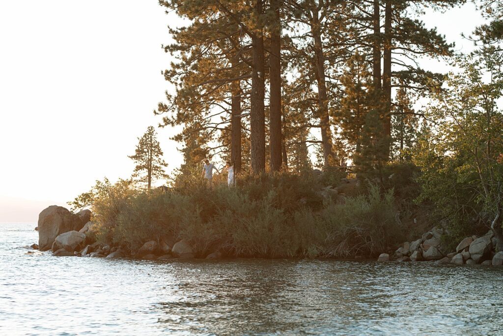 engaged couple walking through the woods in zephyr cove lake tahoe 