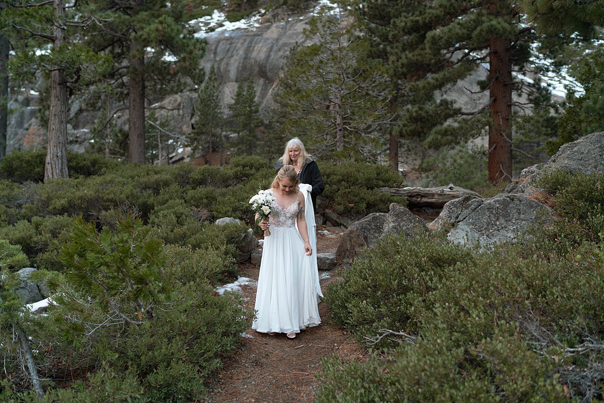 Bride walking down the aisle to her sunrise Elopement ceremony at Emerald Bay captured by Lake Tahoe Wedding Photographer