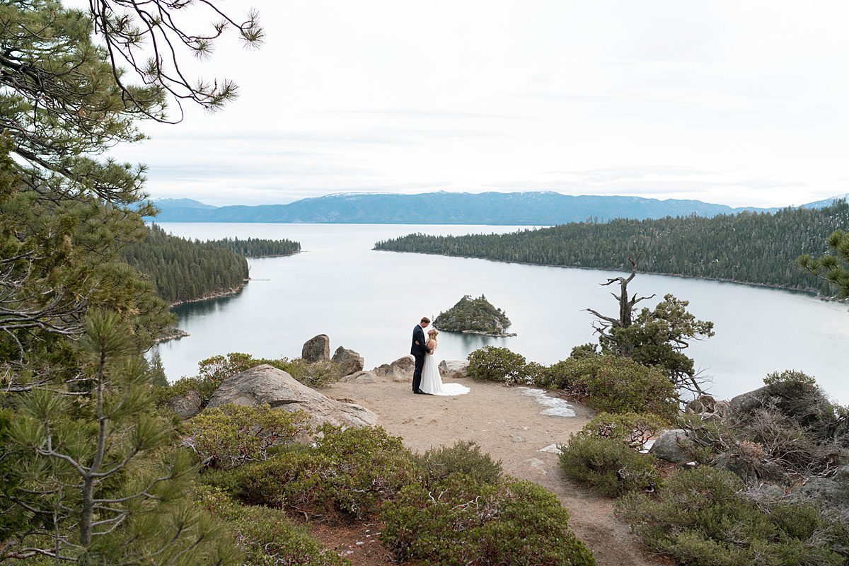 Couple's portrait overlooking Emerald Bay after their ceremony captured by Lake Tahoe Wedding Photographer