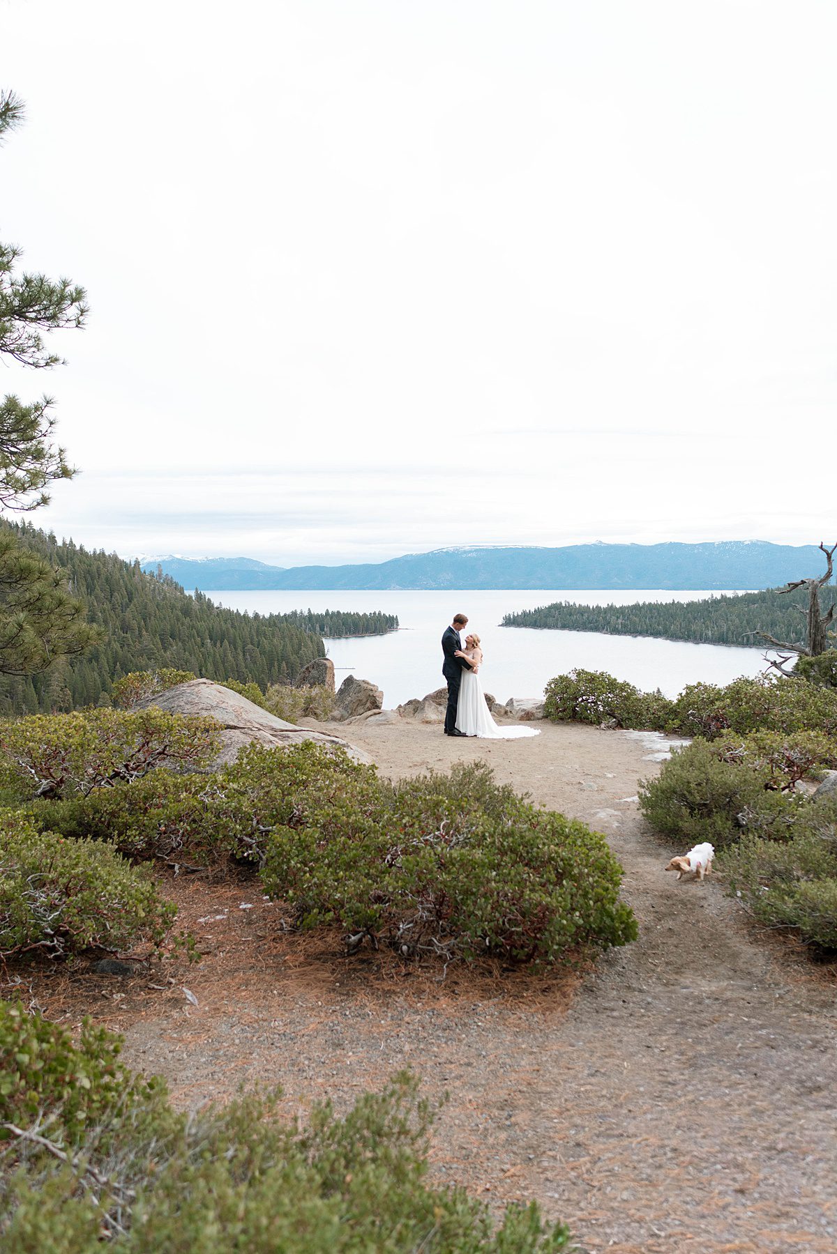 Couple's portrait overlooking Emerald Bay after their ceremony captured by Lake Tahoe Wedding Photographer