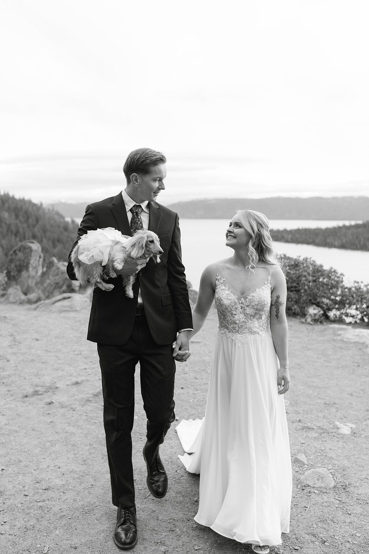 Couple's portrait overlooking Emerald Bay after their ceremony captured by Lake Tahoe Wedding Photographer
