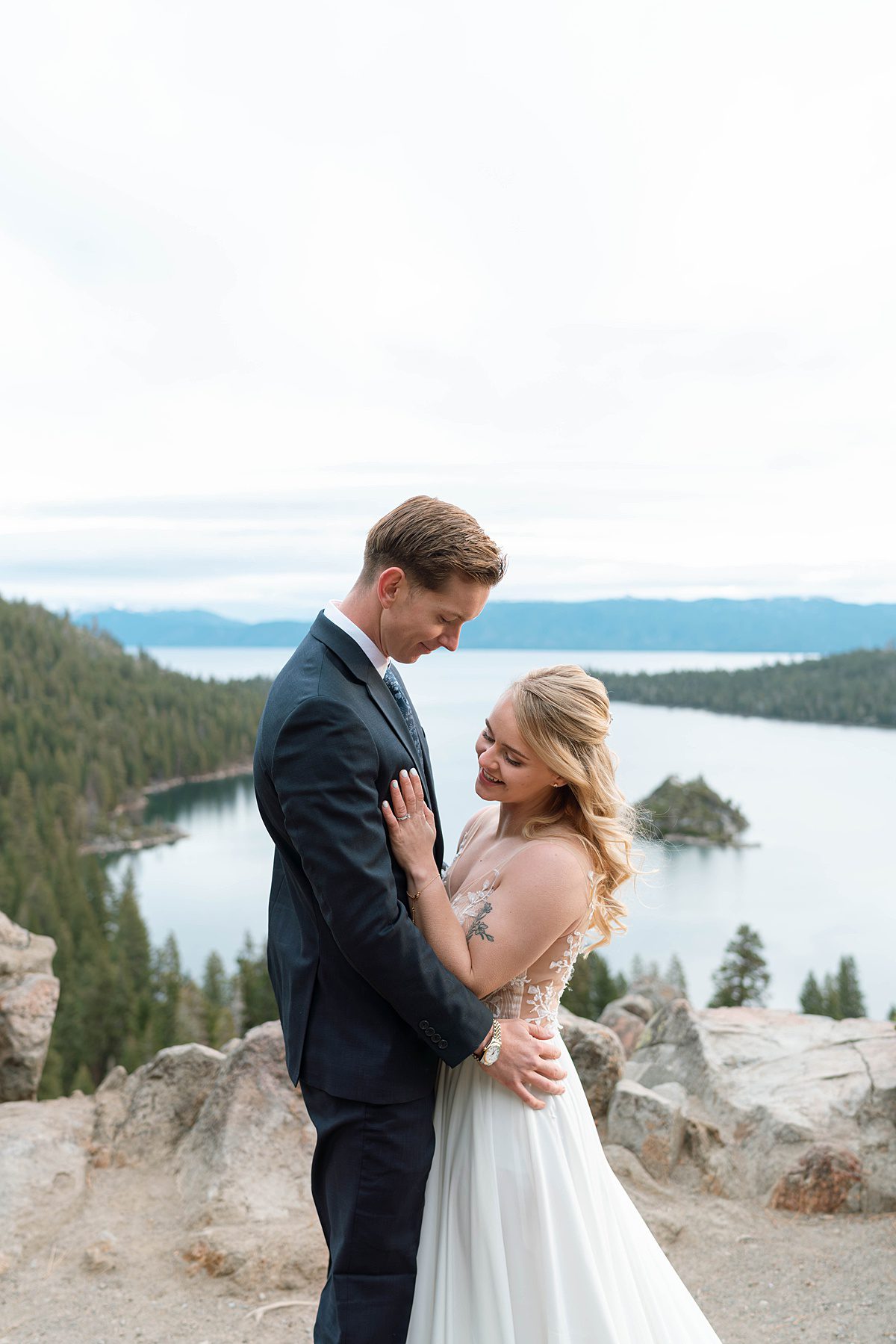 Couple's portrait overlooking Emerald Bay after their ceremony captured by Lake Tahoe Wedding Photographer