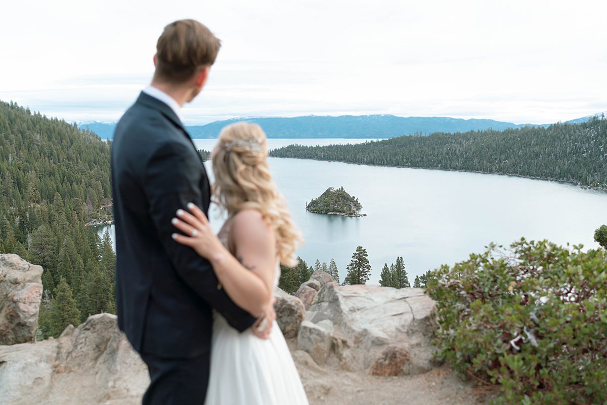 Couple's portrait overlooking Emerald Bay after their ceremony captured by Lake Tahoe Wedding Photographer